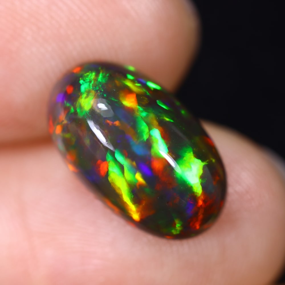 3.27Ct Natural Ethiopian Black Opal - 14.3x8.6x5.4 mm , 605C: Ksmith Heritage Auctioneers Subject: Natural Ethiopian Welo Opal Origin: Ethiopia Treatment: Smoked