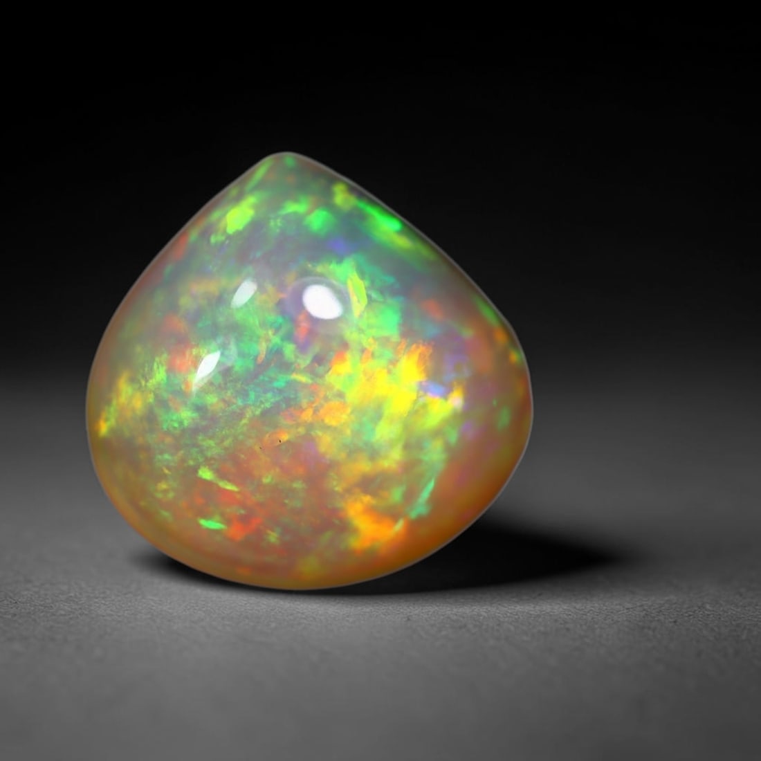 *4.26Ct Welo Opal Polished - Ethiopian Opal - Pear Cabochon, 696B: Ksmith Heritage Auctioneers Subject: Natural Ethiopian Welo Opal Origin: Ethiopia Carat Weight: 4.26Ct Dimension: 12.7 x 12.4 x 6.1 mm Treatment: Natural Untreated Shape: Pear