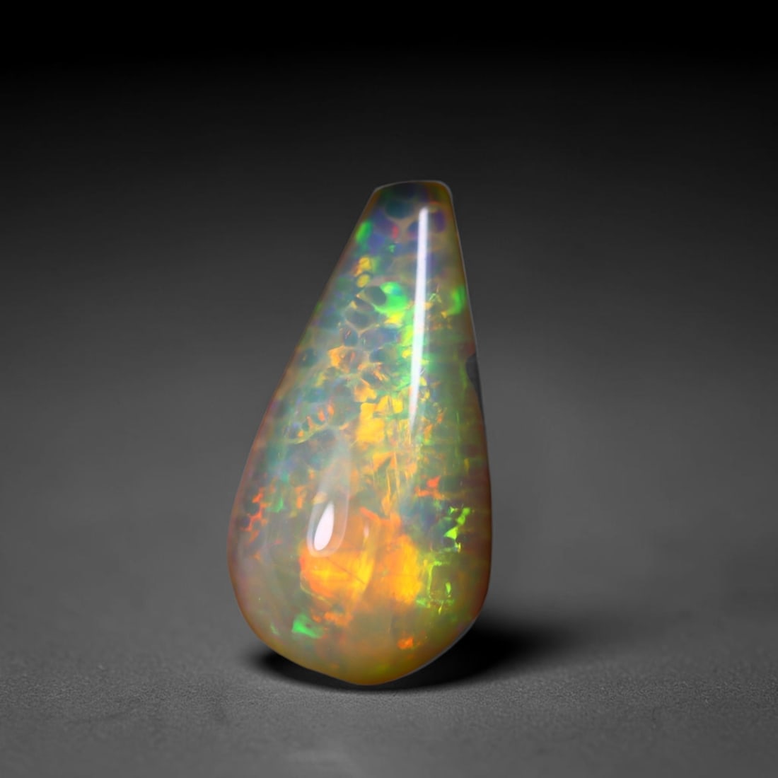 *6.15Ct Teardrop Welo Opal - Ethiopian Opal, 376C: Ksmith Heritage Auctioneers Subject: Natural Ethiopian Welo Opal Origin: Ethiopia Carat Weight: 6.15Ct Dimension: 17.8x9.4x9.3 mm Treatment: Natural Untreated Type: Cabochon, P