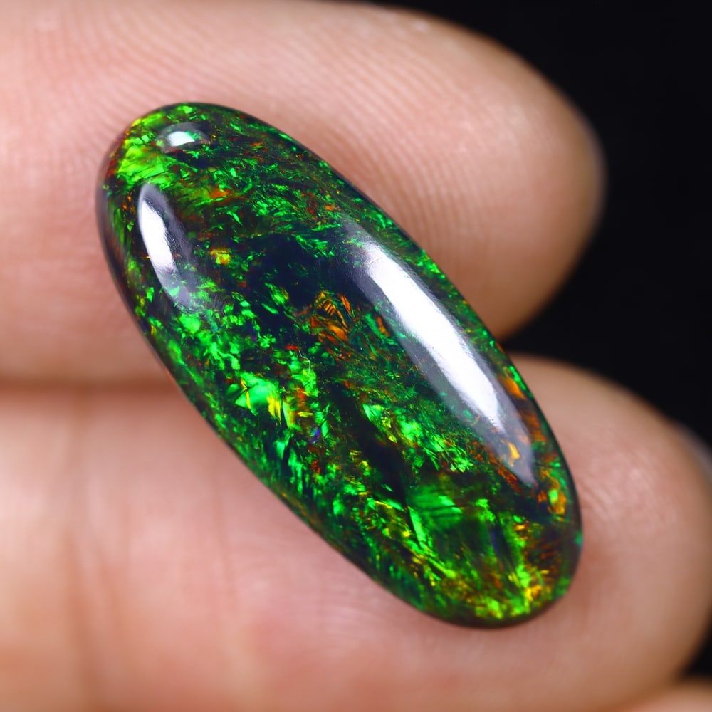 4.28Ct Natural Ethiopian Black Opal - 22.9x10.0x4.0 mm , 594C: Ksmith Heritage Auctioneers Subject: Natural Ethiopian Welo Opal Origin: Ethiopia Treatment: Smoked