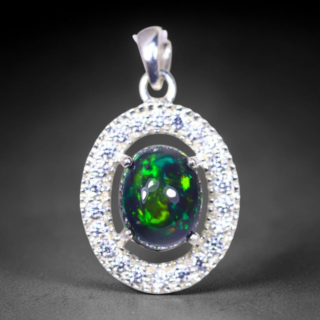 Silver Pendant with Ethiopian Black Opal 3.5grams - 925 Sterling Silver , 1164E: Ksmith Heritage Auctioneers Subject: Opal & Simulated Diamond Silver Pendant Carat Weight: 3.5 grams (approx.) Dimension: Opal 10x7mm, Pendant 22x15mm