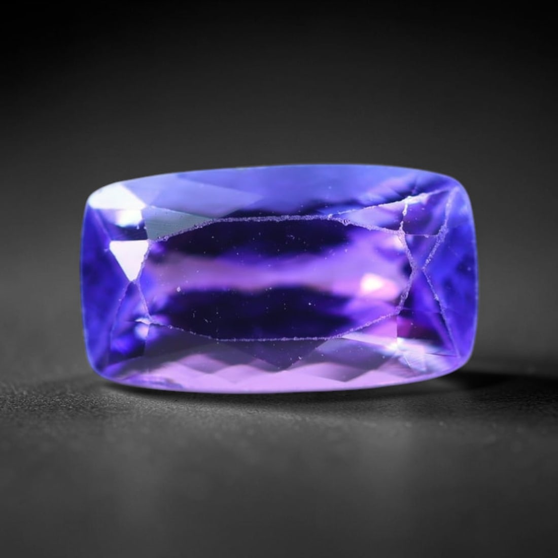 1.93Ct Tanzanite - Polished Faceted - Rectangle Faceted , 140E: Ksmith Heritage Auctioneers Subject: Natural Tanzanite Origin: Tanzania Carat Weight: 1.93Ct Dimension: 9.9 x 5.6 x 3.9 mm Treatment: Heated Shape: Rectangle Type:</