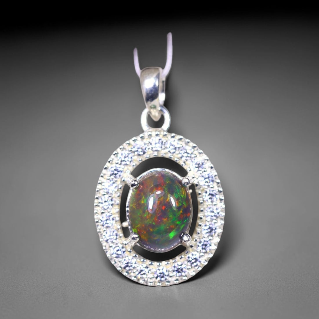 Silver Pendant with Ethiopian Black Opal 3.5grams - 925 Sterling Silver, 798B: Ksmith Heritage Auctioneers Subject: Opal & Simulated Diamond Silver Pendant Carat Weight: 3.5 grams (approx.) Dimension: Opal 10x7mm, Pendant 22x15mm