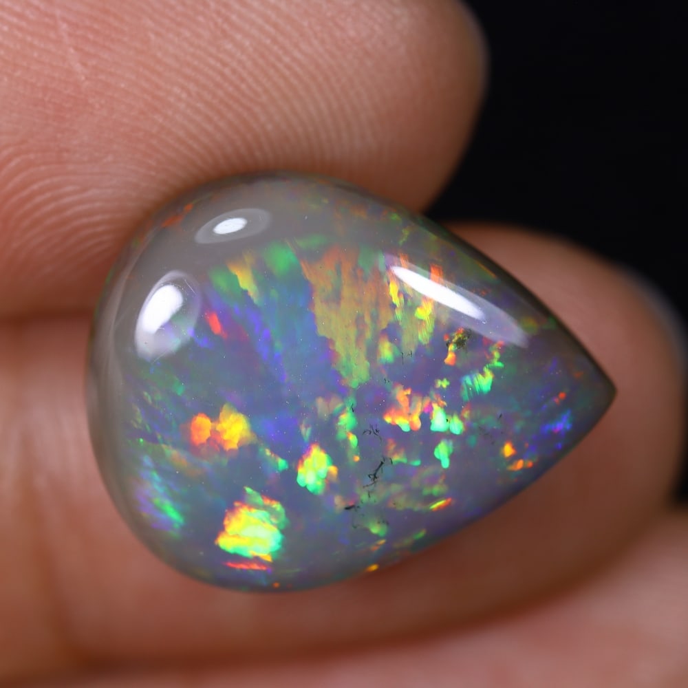 9.74Ct Natural Ethiopian Opal - 18.6x15.0x7.2 mm , 559C: Ksmith Heritage Auctioneers Subject: Natural Ethiopian Welo Opal Origin: Ethiopia Treatment: Unheated