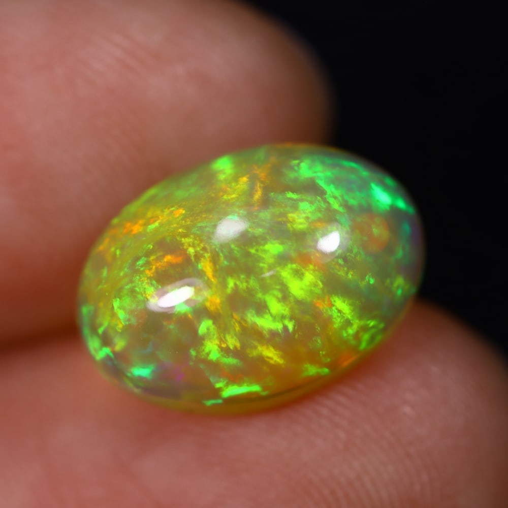 *3.94Ct Welo Opal Polished - Ethiopian Opal , 457C: Ksmith Heritage Auctioneers Subject: Natural Ethiopian Welo Opal Origin: Ethiopia Carat Weight: 3.94Ct Dimension: 13.7x9.6x6.2 mm Treatment: Natural Untreated Type: Caboch