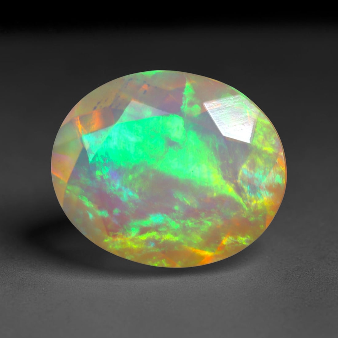 3.14Ct Natural Ethiopian Opal, Faceted Cut - 12.0x10.0x5.8 mm , 654C: Ksmith Heritage Auctioneers Subject: Natural Ethiopian Welo Opal Origin: Ethiopia Treatment: Unheated