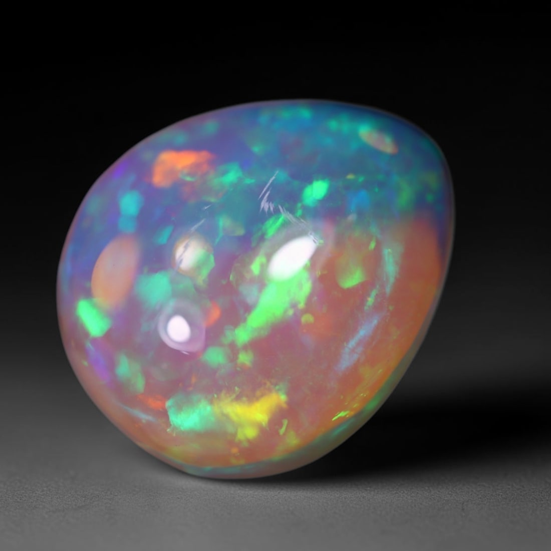 7.47Ct Welo Opal Polished - Ethiopian Opal - Pear Cabochon, 1093B: Ksmith Heritage Auctioneers Subject: Natural Ethiopian Welo Opal Origin: Ethiopia Carat Weight: 7.47Ct Dimension: 16.1 x 13.5 x 6.7 mm Treatment: Natural Untreated Shape: Pear