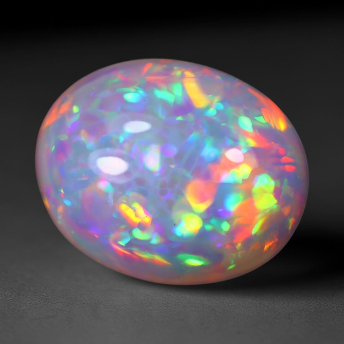*22.76Ct Welo Opal Polished - Ethiopian Opal , 396E: Ksmith Heritage Auctioneers Subject: Natural Ethiopian Welo Opal Origin: Ethiopia Carat Weight: 22.76Ct Dimension: 21.8x17.5x11.6 mm Treatment: Natural Untreated Type: Cab