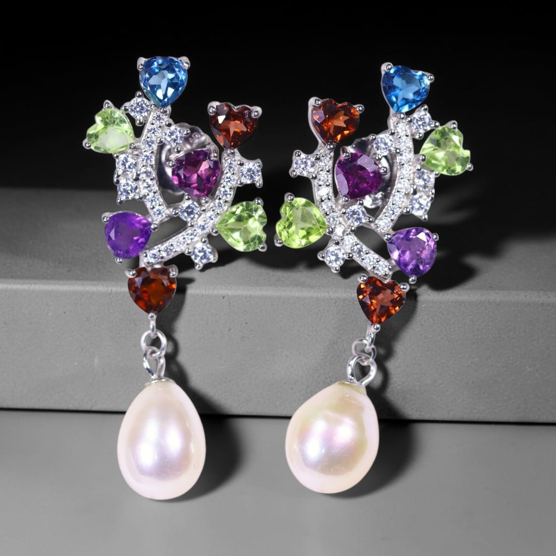 Earrings Pearl and Multi Stone - 925 Sterling Silver - Plated 14K White Gold , 767E: Ksmith Heritage Auctioneers Subject: Natural Amethyst, London Blue Topaz, Mozambique Garnet, Pearl Origin: Thailand Carat Weight: 6.07g Dimension: Gemstone 1-4mm Type: Earrings