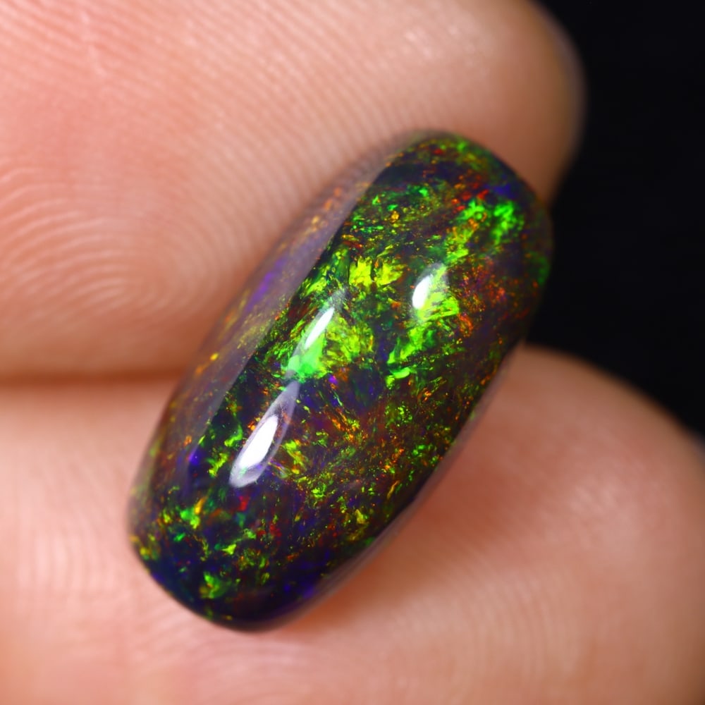 4.65Ct Natural Ethiopian Black Opal - 15.9x7.8x6.4 mm , 584C: Ksmith Heritage Auctioneers Subject: Natural Ethiopian Welo Opal Origin: Ethiopia Treatment: Smoked