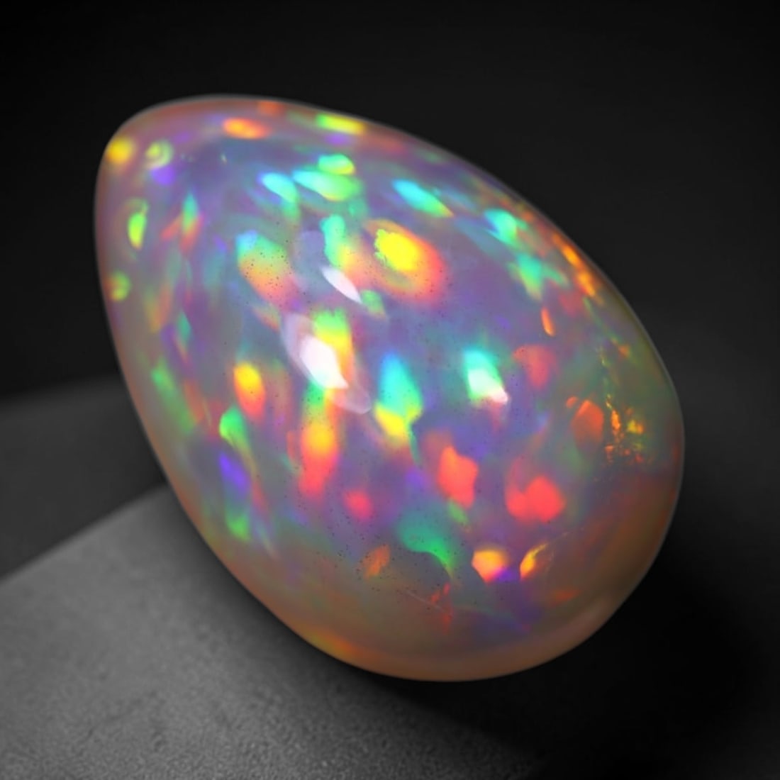 *7.51Ct Welo Opal Polished - Ethiopian Opal, 245B: Ksmith Heritage Auctioneers Subject: Natural Ethiopian Welo Opal Origin: Ethiopia Carat Weight: 7.51Ct Dimension: 16.6x11.1x8.5 mm Treatment: Natural Untreated Type: Cabochon,