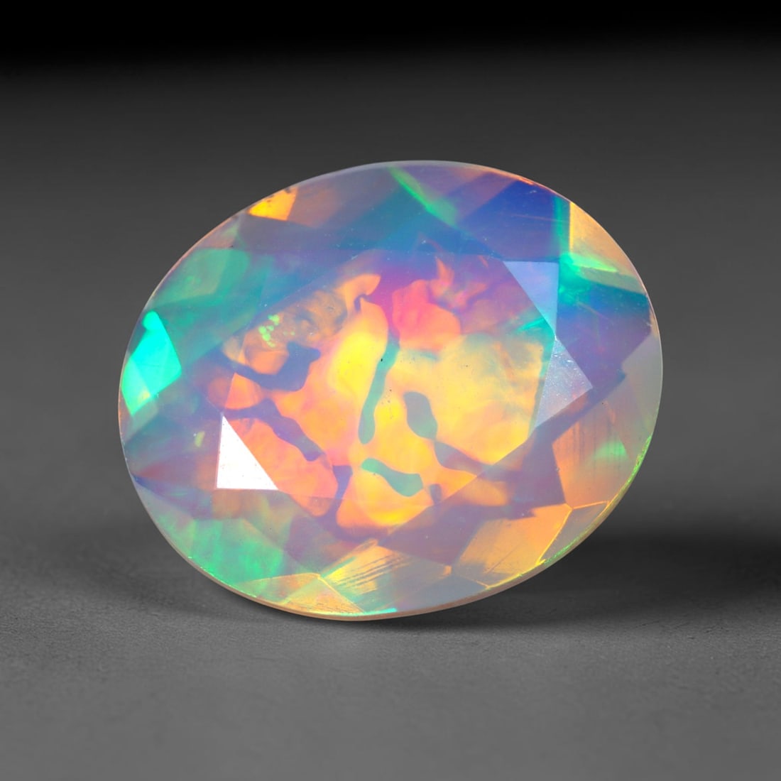 2.45Ct Natural Ethiopian Opal, Faceted Cut - 12.1x10.0x4.7 mm , 648C: Ksmith Heritage Auctioneers Subject: Natural Ethiopian Welo Opal Origin: Ethiopia Treatment: Unheated