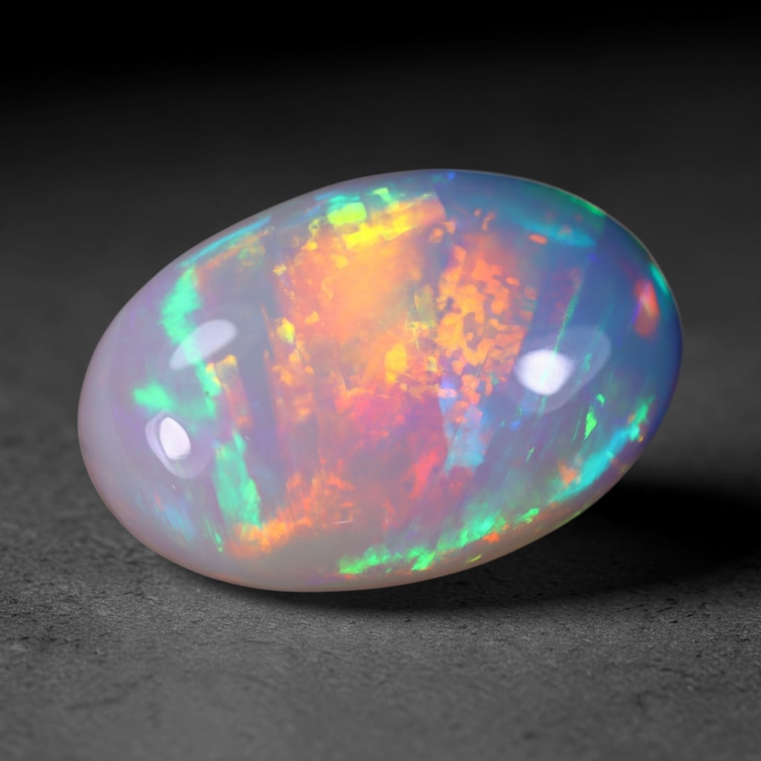 *12.84Ct Welo Opal Polished - Ethiopian Opal, 939B: Ksmith Heritage Auctioneers Subject: Natural Ethiopian Welo Opal Origin: Ethiopia Carat Weight: 12.84Ct Dimension: 22.6x15x7.1 mm Treatment: Natural Untreated Type: Cabochon, P