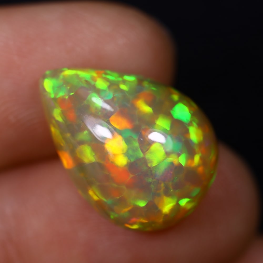 *7.43Ct Welo Opal Polished - Ethiopian Opal , 428C: Ksmith Heritage Auctioneers Subject: Natural Ethiopian Welo Opal Origin: Ethiopia Carat Weight: 7.43Ct Dimension: 18.1x13.2x7.8 mm Treatment: Natural Untreated Type: Caboc