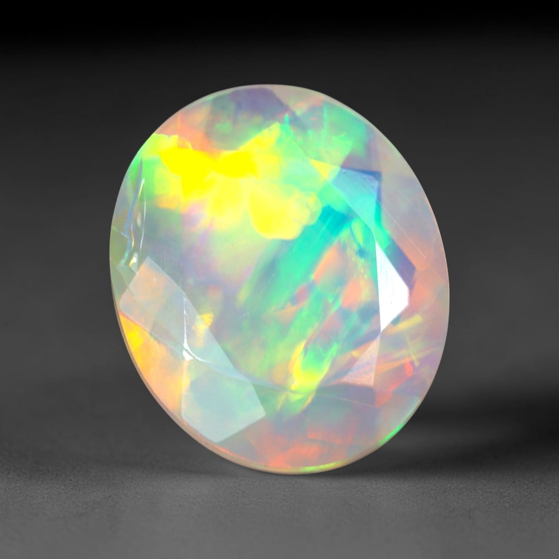 2.85Ct Natural Ethiopian Opal, Faceted Cut - 12.0x10.0x5.2 mm , 656C: Ksmith Heritage Auctioneers Subject: Natural Ethiopian Welo Opal Origin: Ethiopia Treatment: Unheated