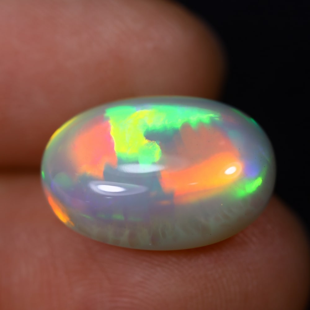*6.49Ct Welo Opal Polished - Ethiopian Opal , 409C: Ksmith Heritage Auctioneers Subject: Natural Ethiopian Welo Opal Origin: Ethiopia Carat Weight: 6.49Ct Dimension: 16.5x11.2x7.1 mm Treatment: Natural Untreated Type: Caboc