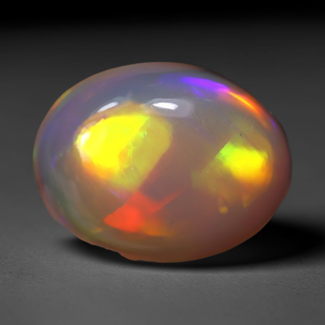 4.28Ct Welo Opal Polished - Ethiopian Opal, 743B: Ksmith Heritage Auctioneers Subject: Natural Ethiopian Welo Opal Origin: Ethiopia Carat Weight: 4.28Ct Dimension: 13.8x10.6x5.6 mm Treatment: Natural Untreated Type: Cabochon,