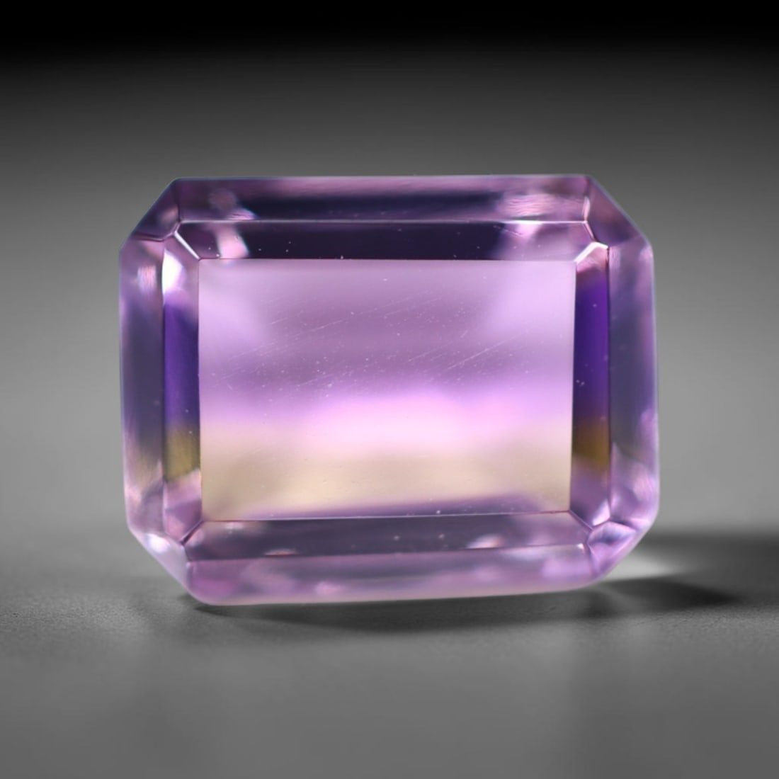 1.92Ct Ametrine - Polished Faceted - Rectangle Faceted , 792E: Ksmith Heritage Auctioneers Subject: Natural Ametrine Origin: Bolivia Carat Weight: 1.92Ct Dimension: 8 x 6.2 x 4.5 mm Treatment: Unheated Shape: Rectangle Type: