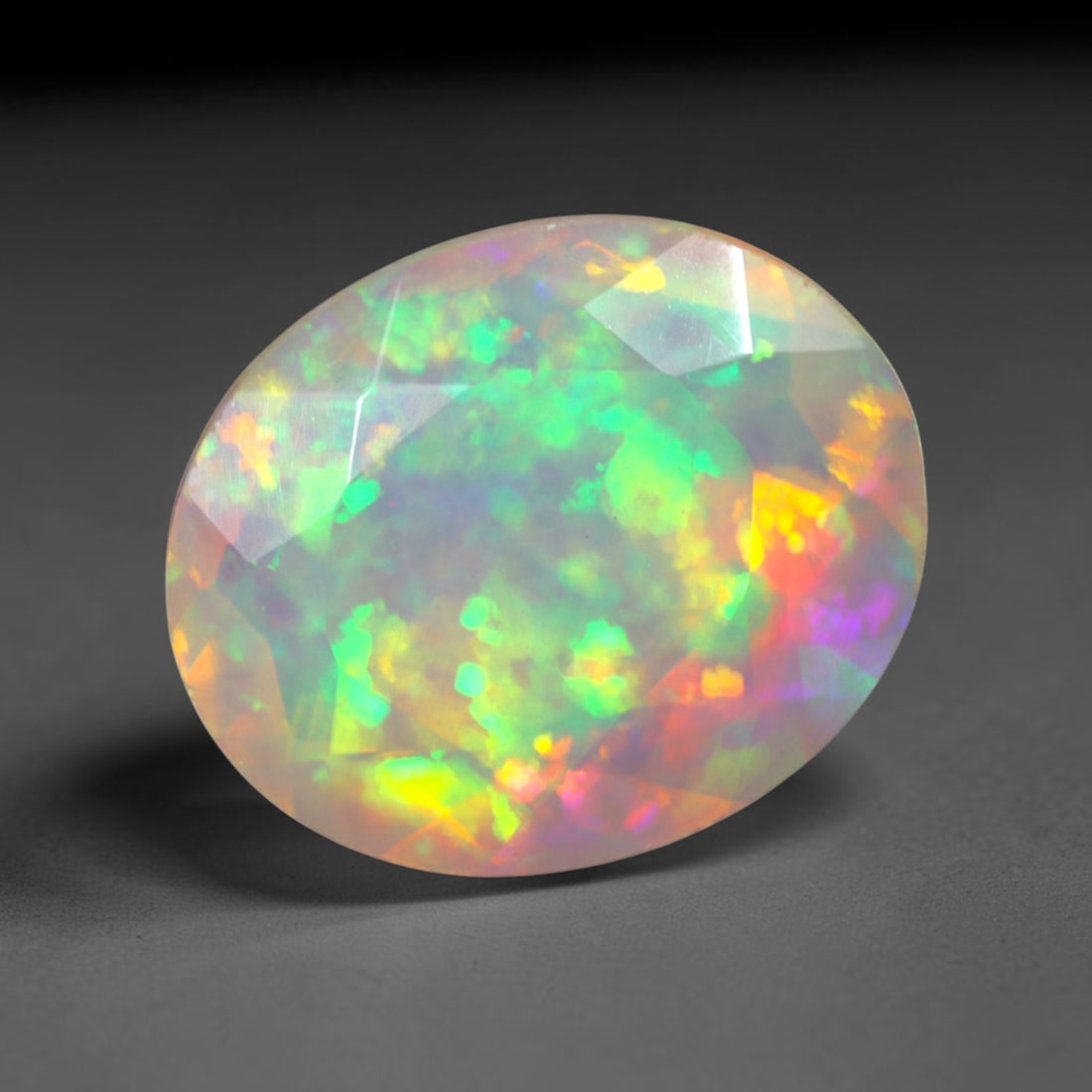 2.11Ct Natural Ethiopian Opal, Faceted Cut - 11.0x9.0x4.9 mm , 637C: Ksmith Heritage Auctioneers Subject: Natural Ethiopian Welo Opal Origin: Ethiopia Treatment: Unheated
