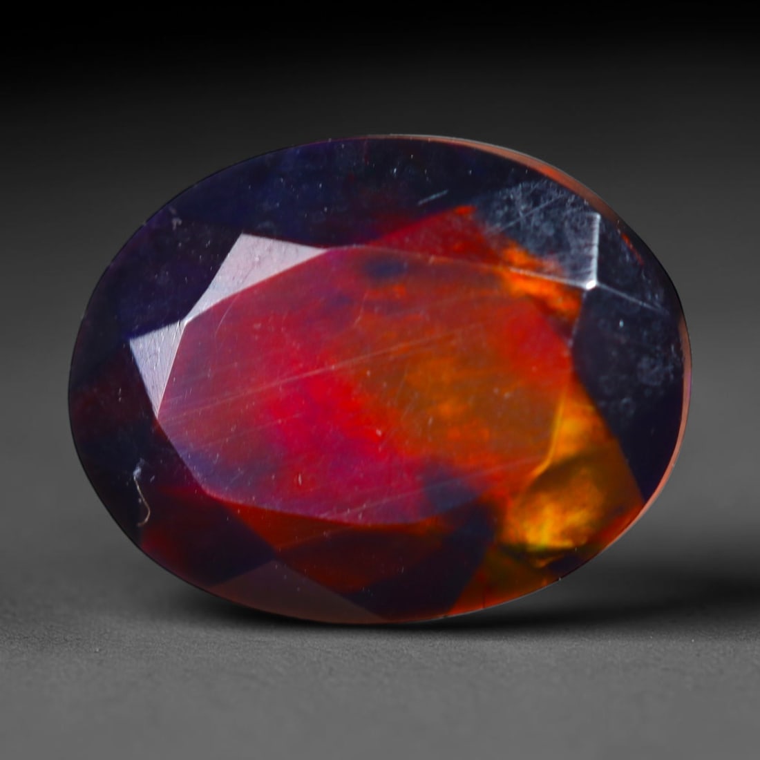 2.29Ct Natural Smoked Ethiopian Black Opal, Faceted Cut - 10.3x8.1x6.2 mm , 706C: Ksmith Heritage Auctioneers Subject: Natural Ethiopian Welo Opal Origin: Ethiopia Treatment: Smoked