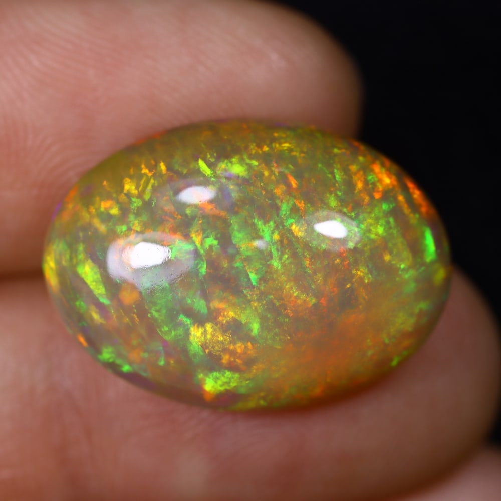 *12.11Ct Welo Opal Polished - Ethiopian Opal , 449C: Ksmith Heritage Auctioneers Subject: Natural Ethiopian Welo Opal Origin: Ethiopia Carat Weight: 12.11Ct Dimension: 20.1x15.1x7.8mm Treatment: Natural Untreated Type: Caboc