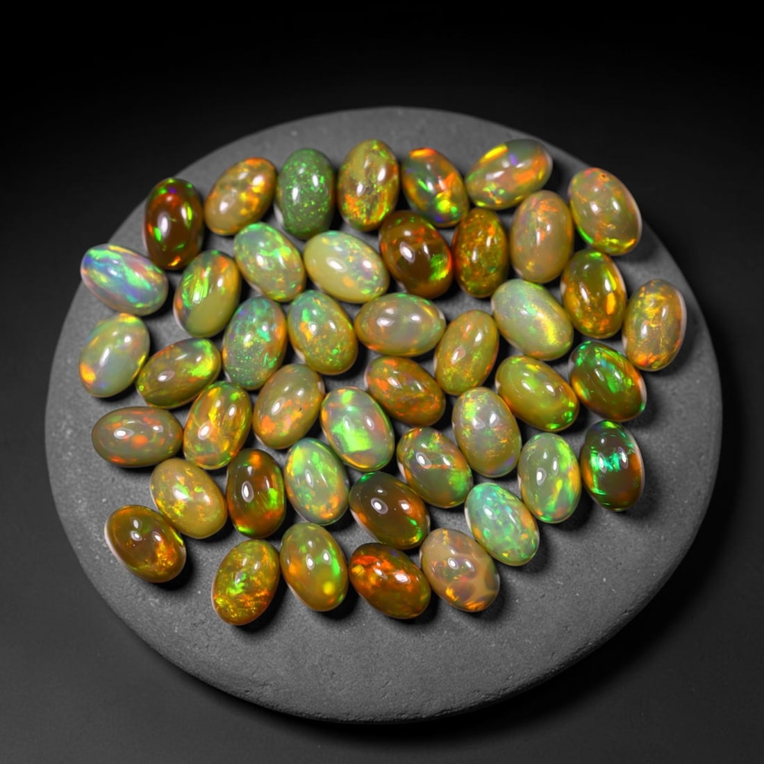 *15.91Ct 6x4mm Welo Opal Lot - Ethiopian Opal, 373C: Ksmith Heritage Auctioneers Subject: Natural Ethiopian Welo Opal Origin: Ethiopia Carat Weight: 15.91Ct Dimension: 6x4x2.6 mm Treatment: Natural Untreated Type: Cabochon, Polis
