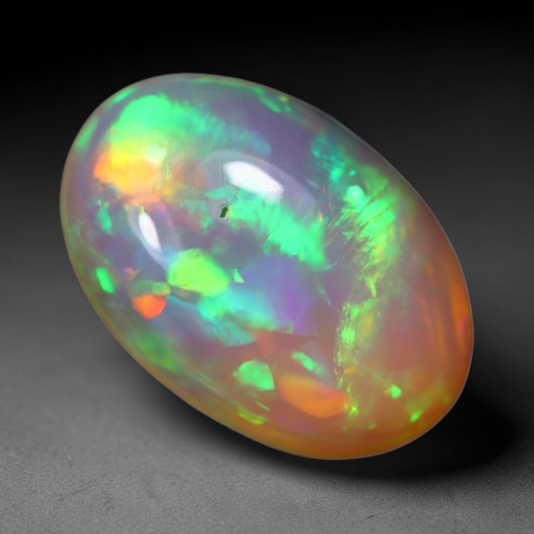 3.50Ct Welo Opal Polished - Ethiopian Opal, 779B: Ksmith Heritage Auctioneers Subject: Natural Ethiopian Welo Opal Origin: Ethiopia Carat Weight: 3.50Ct Dimension: 14x9.6x5.4 mm Treatment: Natural Untreated Type: Cabochon, Pol