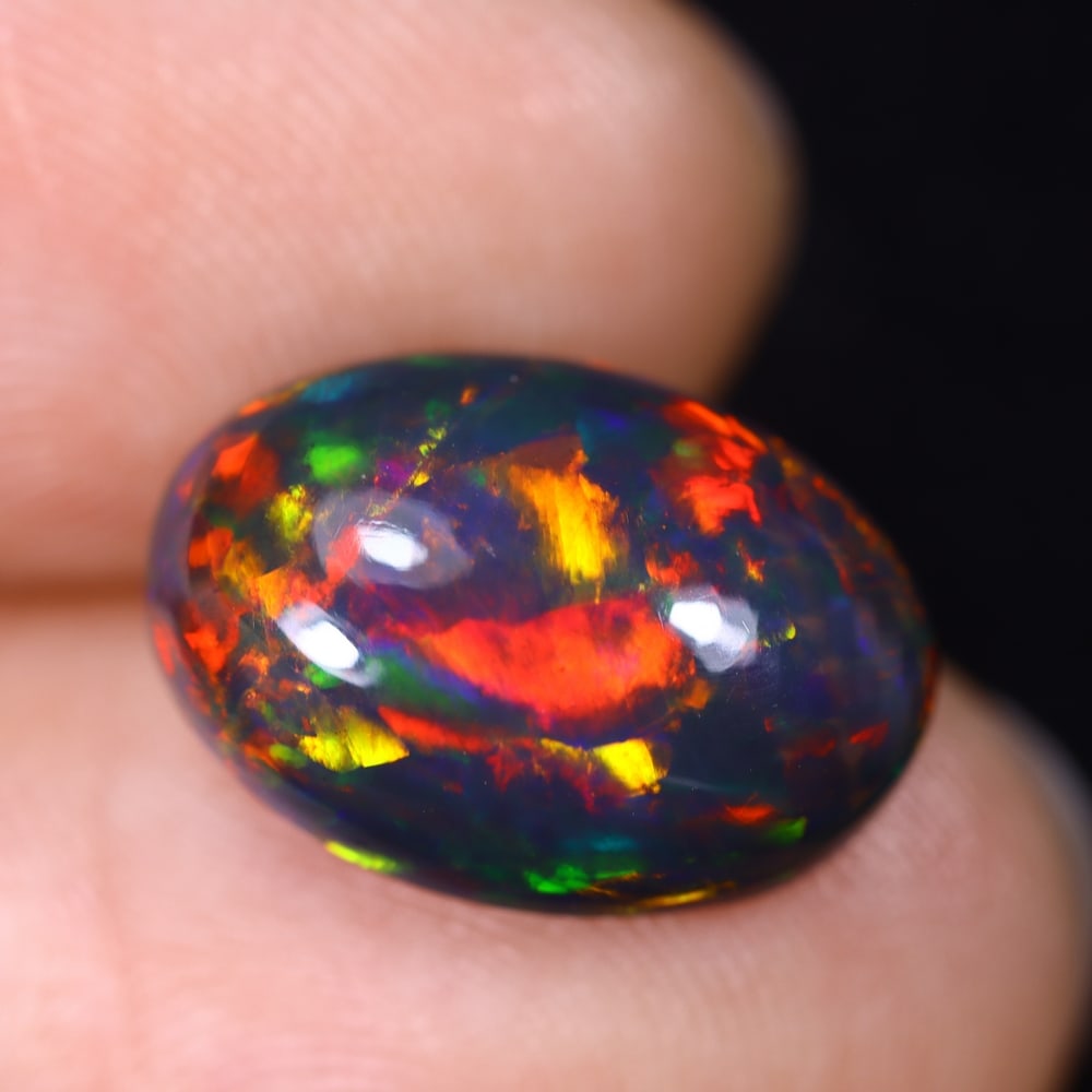 4.53Ct Natural Ethiopian Black Opal - 14.7x10.2x5.8 mm , 608C: Ksmith Heritage Auctioneers Subject: Natural Ethiopian Welo Opal Origin: Ethiopia Treatment: Smoked