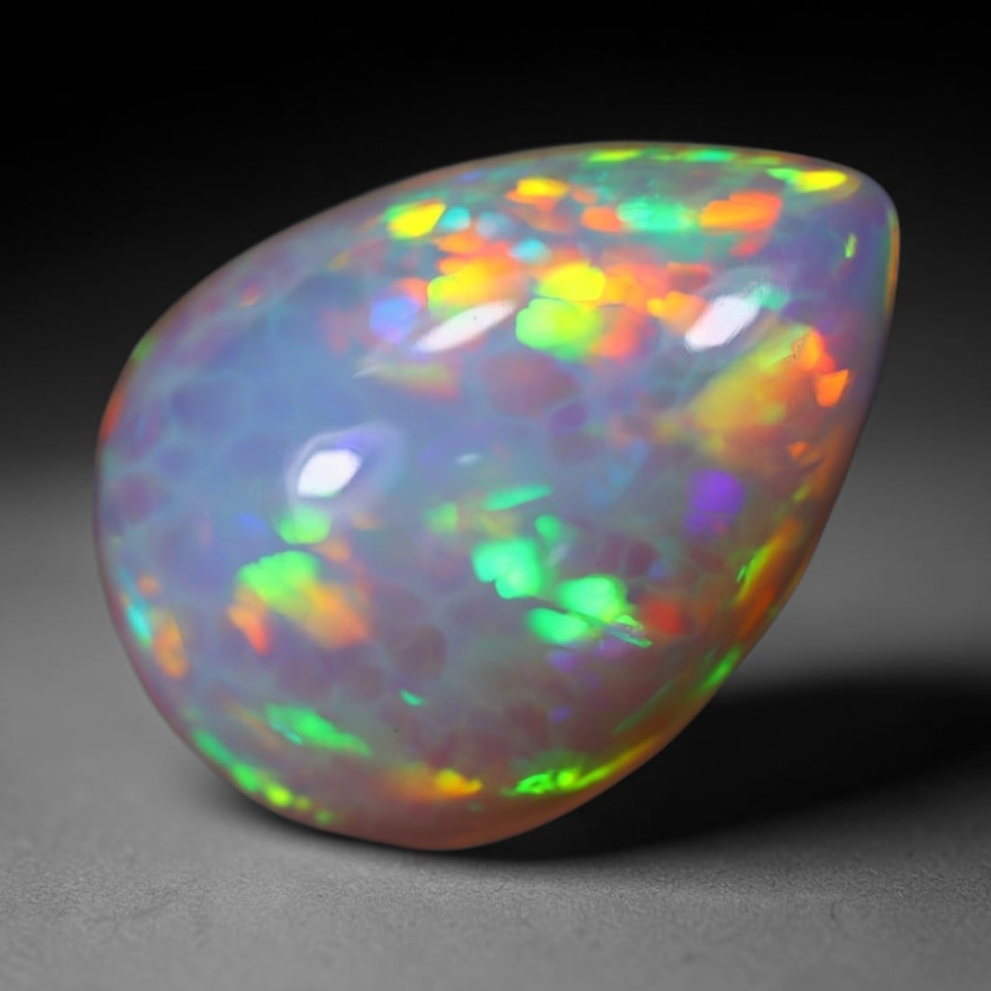 *8.90Ct Welo Opal Polished - Ethiopian Opal, 548B: Ksmith Heritage Auctioneers Subject: Natural Ethiopian Welo Opal Origin: Ethiopia Carat Weight: 8.90Ct Dimension: 19.9x14.4x7.3 mm Treatment: Natural Untreated Type: Cabochon,