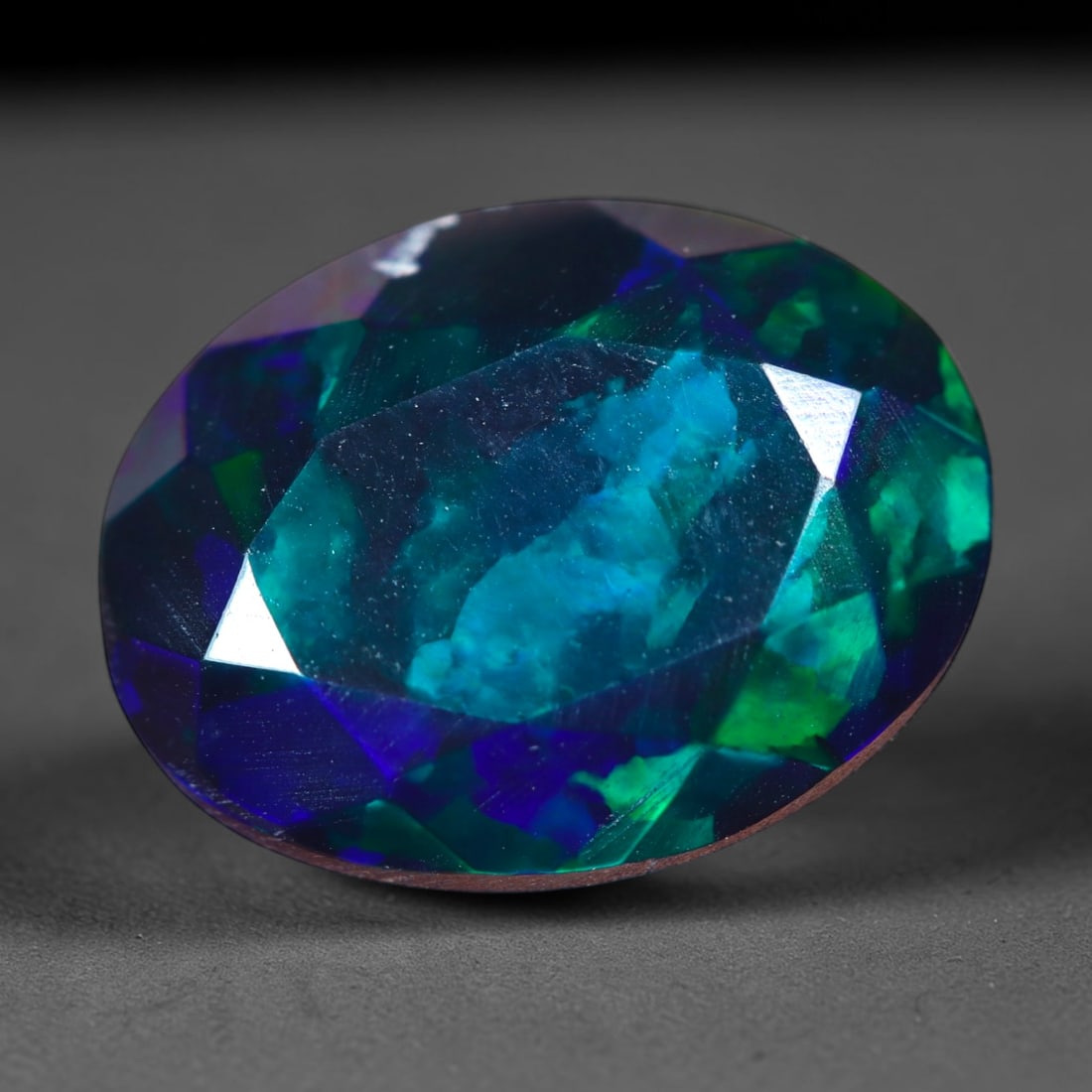 2.16Ct Natural Smoked Ethiopian Black Opal, Faceted Cut - 11.3x8.7x5.1 mm , 698C: Ksmith Heritage Auctioneers Subject: Natural Ethiopian Welo Opal Origin: Ethiopia Treatment: Smoked