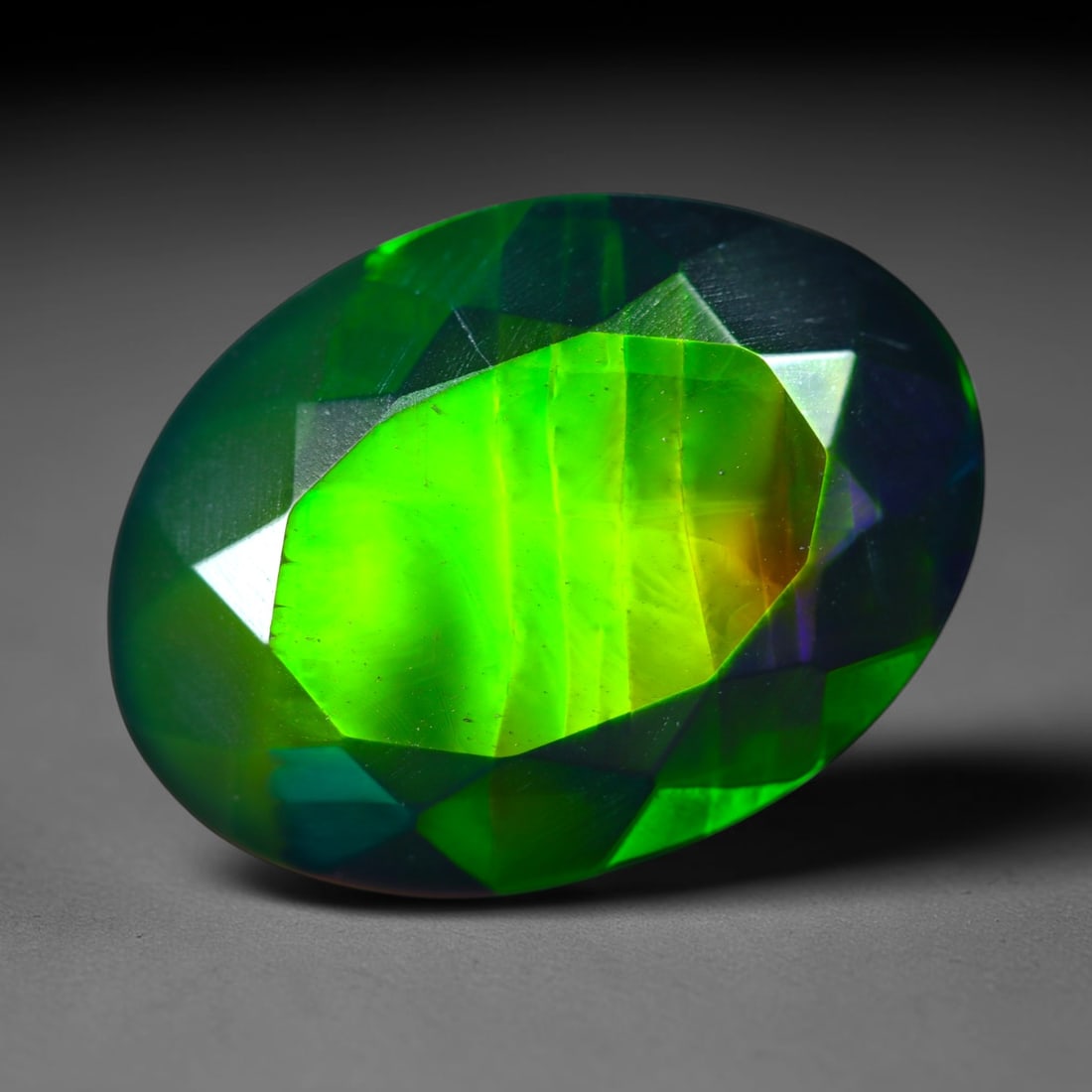 3.24Ct Natural Smoked Ethiopian Black Opal, Faceted Cut - 13.7x10.2x5.3 mm , 709C: Ksmith Heritage Auctioneers Subject: Natural Ethiopian Welo Opal Origin: Ethiopia Treatment: Smoked