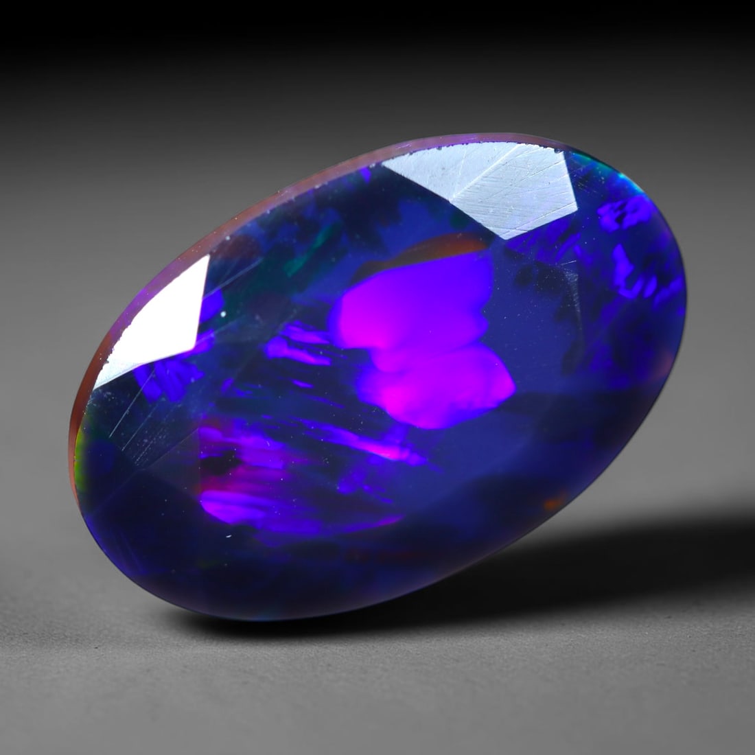 2.30Ct Natural Smoked Ethiopian Black Opal, Faceted Cut - 12.6x8.4x5.1 mm , 704C: Ksmith Heritage Auctioneers Subject: Natural Ethiopian Welo Opal Origin: Ethiopia Treatment: Smoked