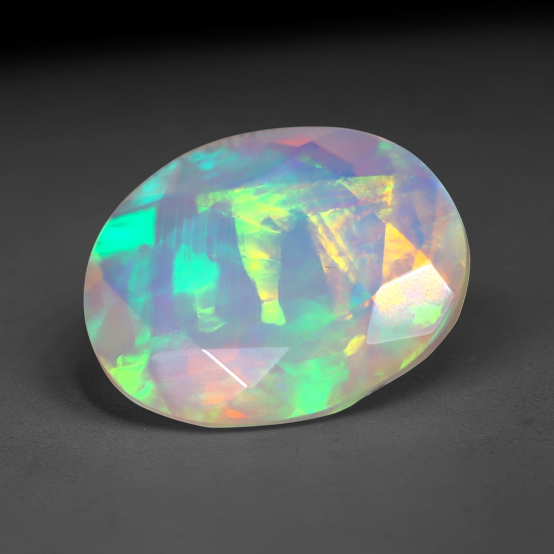 2.74Ct Natural Ethiopian Opal, Faceted Cut - 12.0x9.8x5.8 mm , 688C: Ksmith Heritage Auctioneers Subject: Natural Ethiopian Welo Opal Origin: Ethiopia Treatment: Unheated