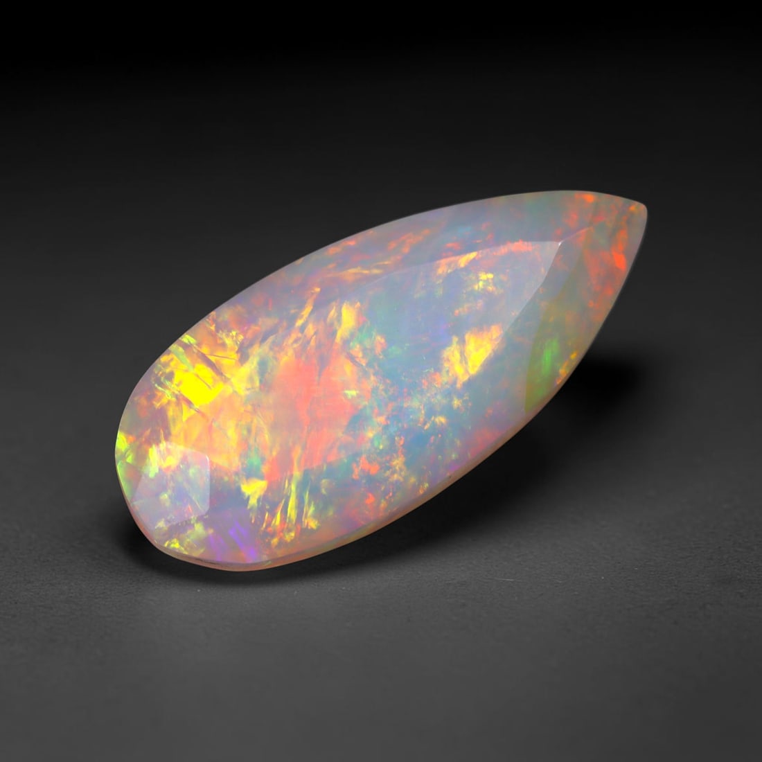 3.80Ct Natural Ethiopian Opal, Faceted Cut - 17.9x8.2x6.0 mm , 690C: Ksmith Heritage Auctioneers Subject: Natural Ethiopian Welo Opal Origin: Ethiopia Treatment: Unheated