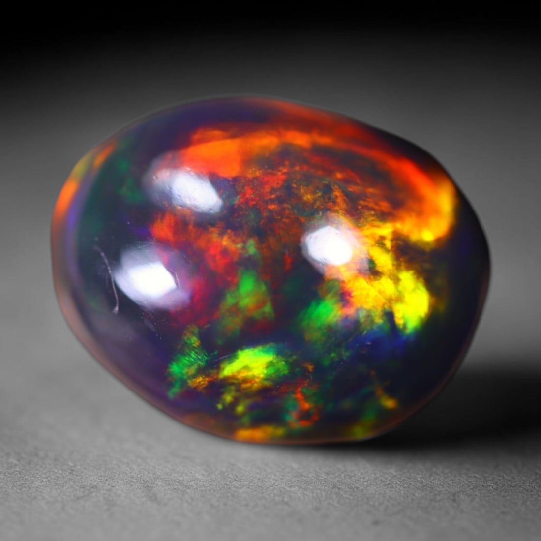 *3.43Ct Welo Black Opal Polished - Ethiopian Opal, 388B: Ksmith Heritage Auctioneers Subject: Natural Ethiopian Welo Black Opal Origin: Ethiopia Carat Weight: 3.43Ct Dimension: 12.2x9.7x5.9 mm Treatment: Smoked Type: Cabochon, Polish