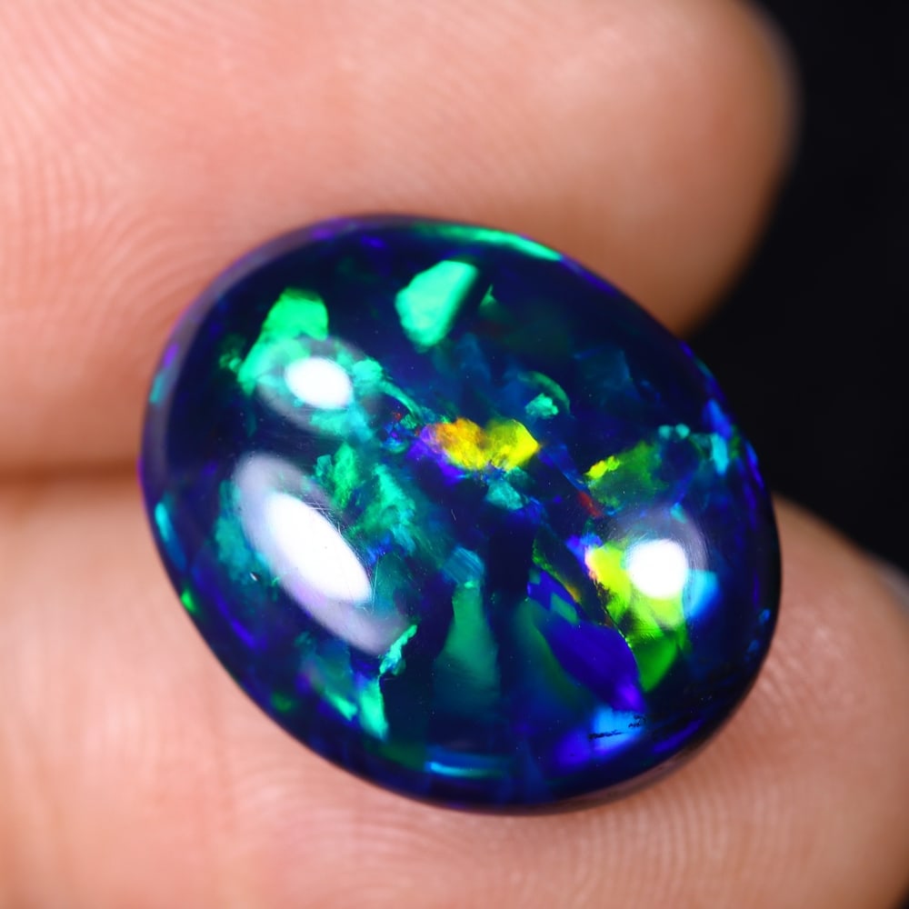 6.74Ct Natural Ethiopian Black Opal - 16.9x13.7x6.0 mm , 586C: Ksmith Heritage Auctioneers Subject: Natural Ethiopian Welo Opal Origin: Ethiopia Treatment: Smoked