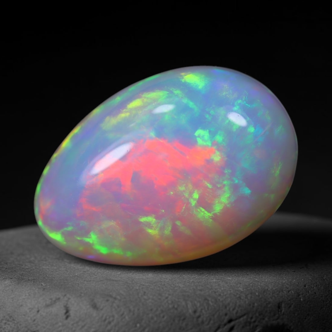 *6.13Ct Welo Opal Polished - Ethiopian Opal, 881B: Ksmith Heritage Auctioneers Subject: Natural Ethiopian Welo Opal Origin: Ethiopia Carat Weight: 6.13Ct Dimension: 16x11.6x6.3 mm Treatment: Natural Untreated Type: Cabochon, Po