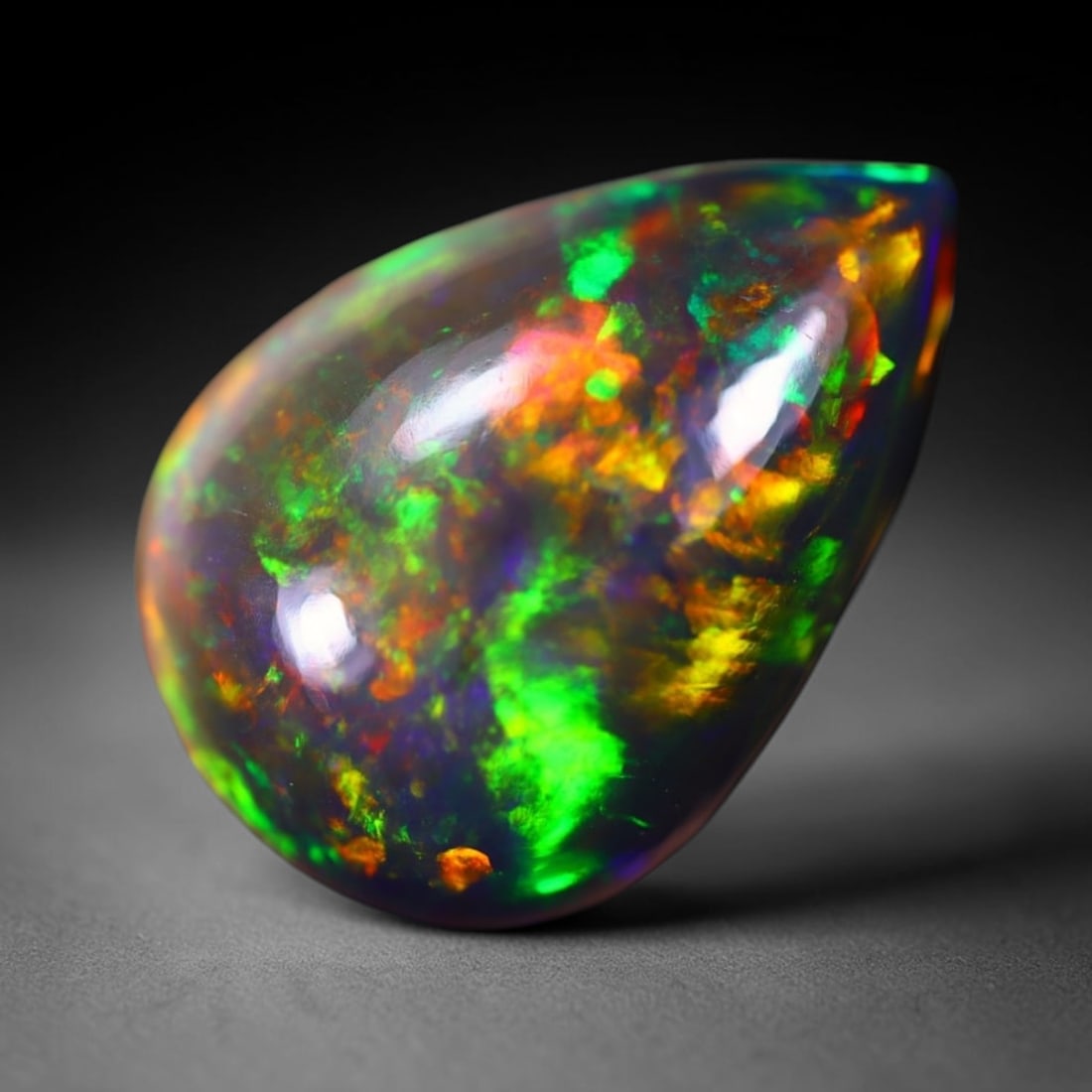 *5.06Ct Welo Black Opal Polished - Ethiopian Opal - Pear Cabochon , 358E: Ksmith Heritage Auctioneers Subject: Natural Ethiopian Welo Black Opal Origin: Ethiopia Carat Weight: 5.06Ct Dimension: 16.2x11.4x5.9 mm Treatment: Smoked Shape: Pear <