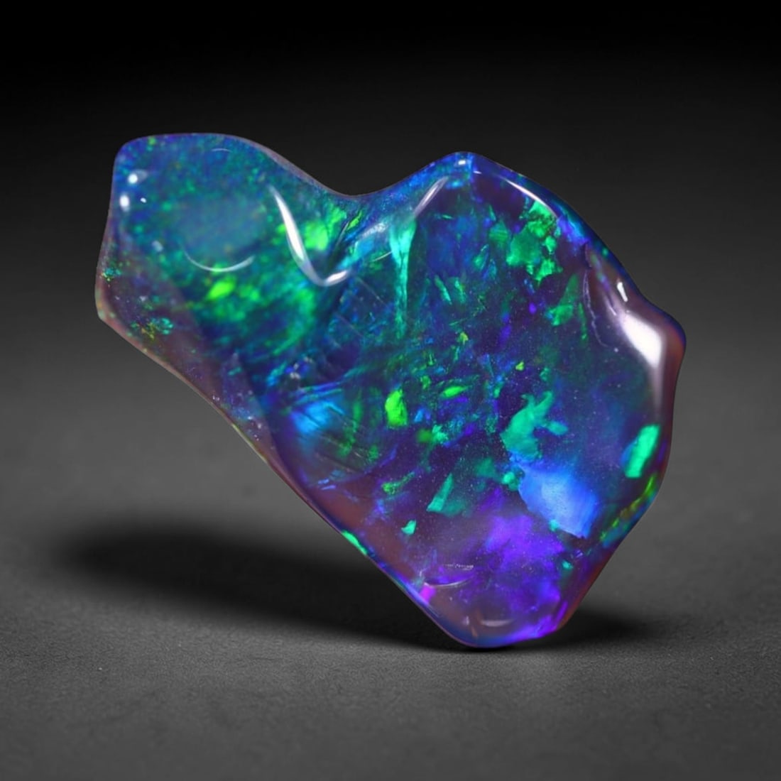 *2.05Ct Smoked Freeform Welo Opal Polished - Ethiopian Opal , 208C: Ksmith Heritage Auctioneers Subject: Natural Ethiopian Welo Opal Origin: Ethiopia Carat Weight: 2.05Ct Dimension: 15.4x9.5x4.1 mm Treatment: Smoked Type: Freeform, Polishe
