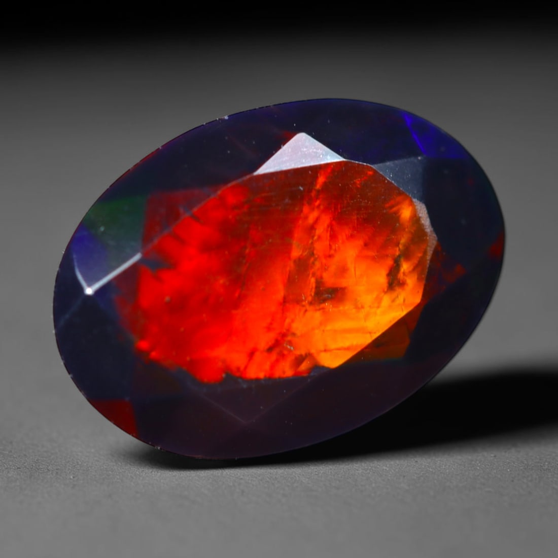 2.09Ct Natural Smoked Ethiopian Black Opal, Faceted Cut - 11.6x8.4x6.1 mm , 729C: Ksmith Heritage Auctioneers Subject: Natural Ethiopian Welo Opal Origin: Ethiopia Treatment: Smoked
