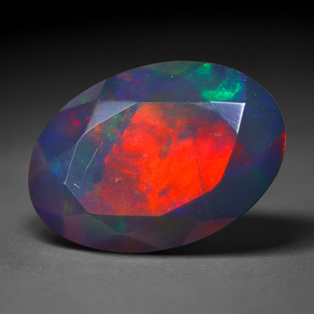 1.95Ct Natural Smoked Ethiopian Black Opal, Faceted Cut - 11.2x7.7x5.3 mm , 719C: Ksmith Heritage Auctioneers Subject: Natural Ethiopian Welo Opal Origin: Ethiopia Treatment: Smoked