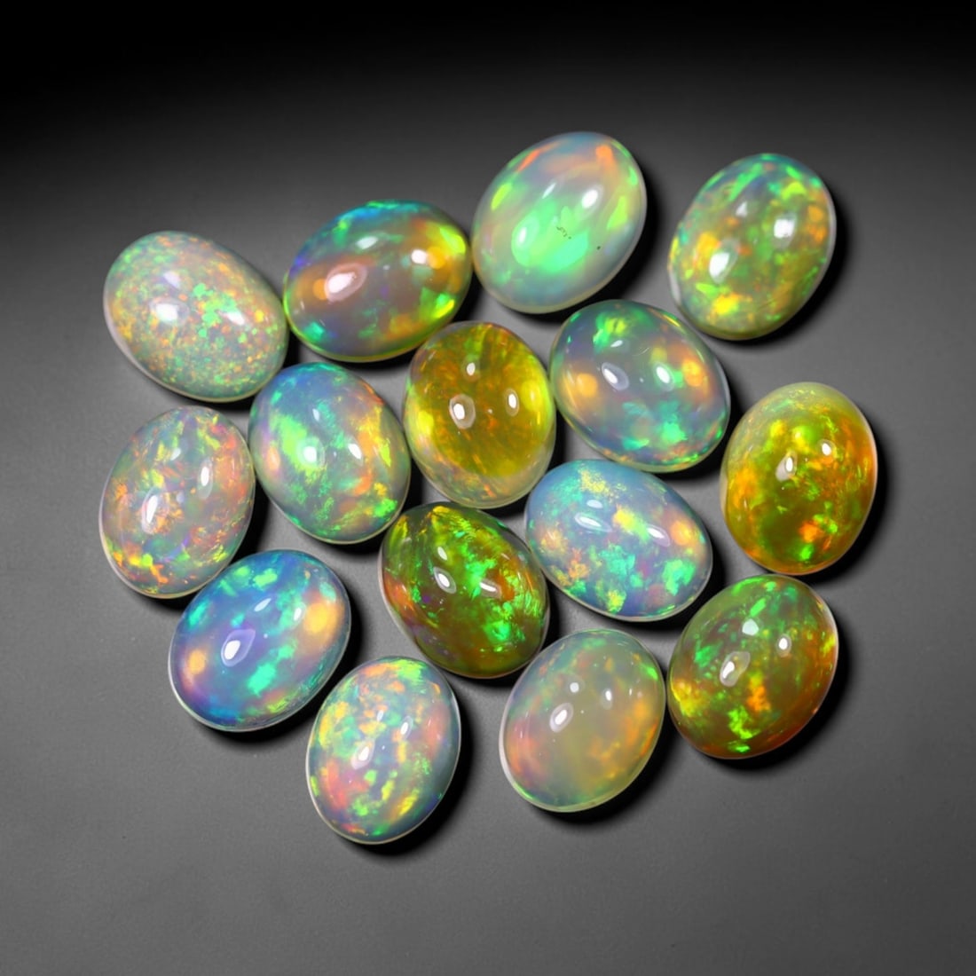 *19.10Ct 9x7mm Welo Opal Lot - Ethiopian Opal, 367C: Ksmith Heritage Auctioneers Subject: Natural Ethiopian Welo Opal Origin: Ethiopia Carat Weight: 19.10Ct Dimension: 9x7x3.8 mm Treatment: Natural Untreated Type: Cabochon, Polis