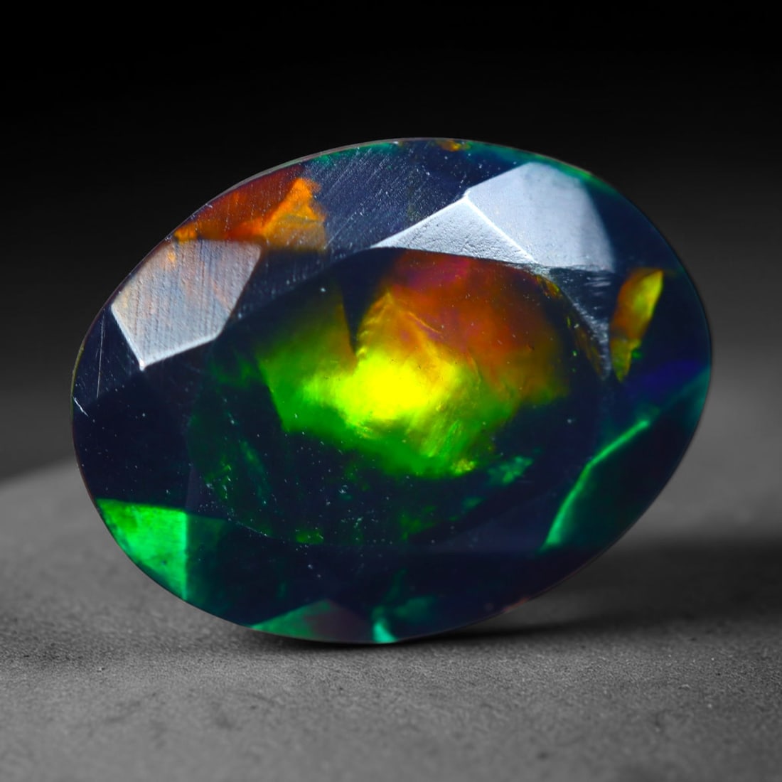 2.14Ct Natural Smoked Ethiopian Black Opal, Faceted Cut - 10.4x8.0x6.1 mm , 725C: Ksmith Heritage Auctioneers Subject: Natural Ethiopian Welo Opal Origin: Ethiopia Treatment: Smoked