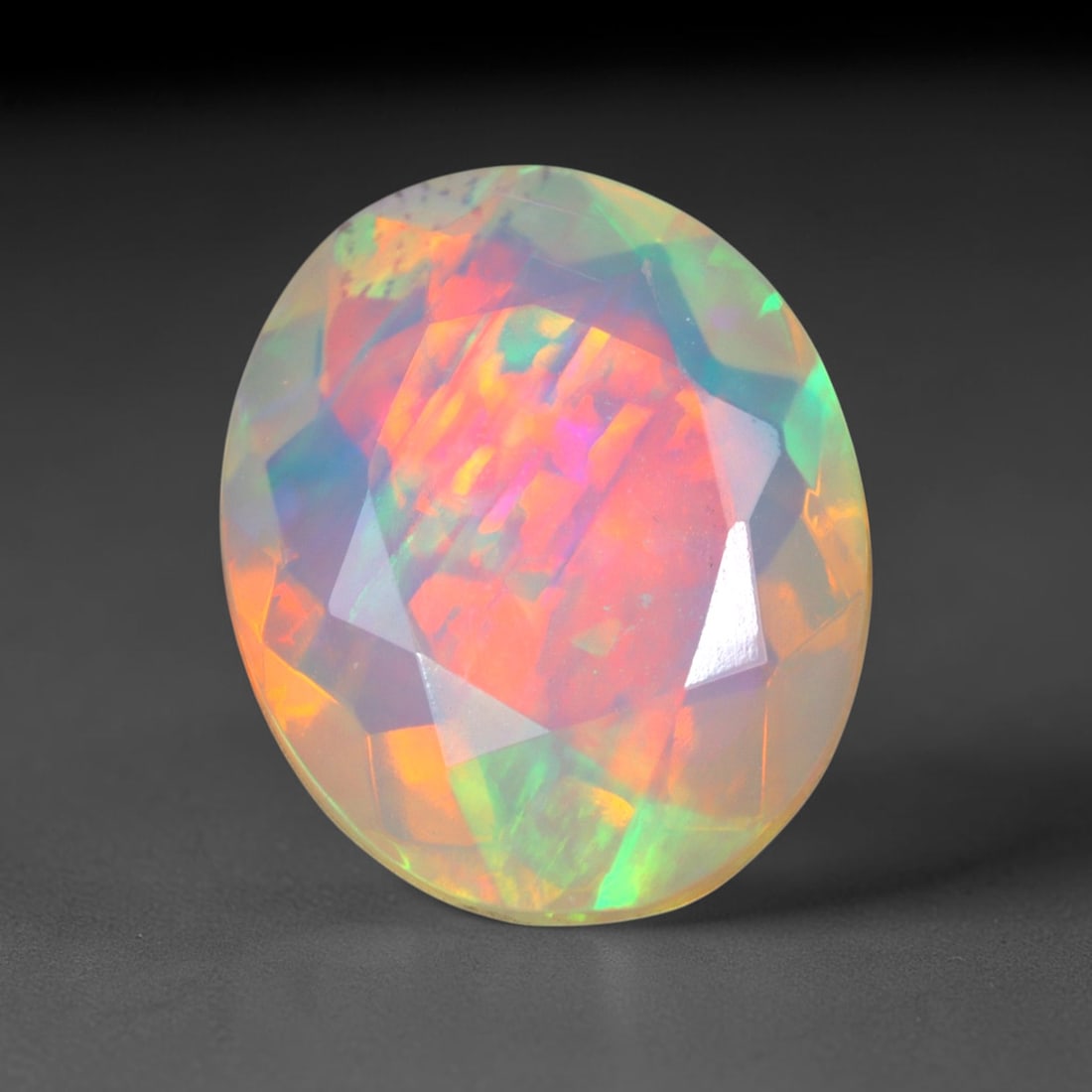 2.11Ct Natural Ethiopian Opal, Faceted Cut - 11.1x9.0x5.0 mm , 632C: Ksmith Heritage Auctioneers Subject: Natural Ethiopian Welo Opal Origin: Ethiopia Treatment: Unheated