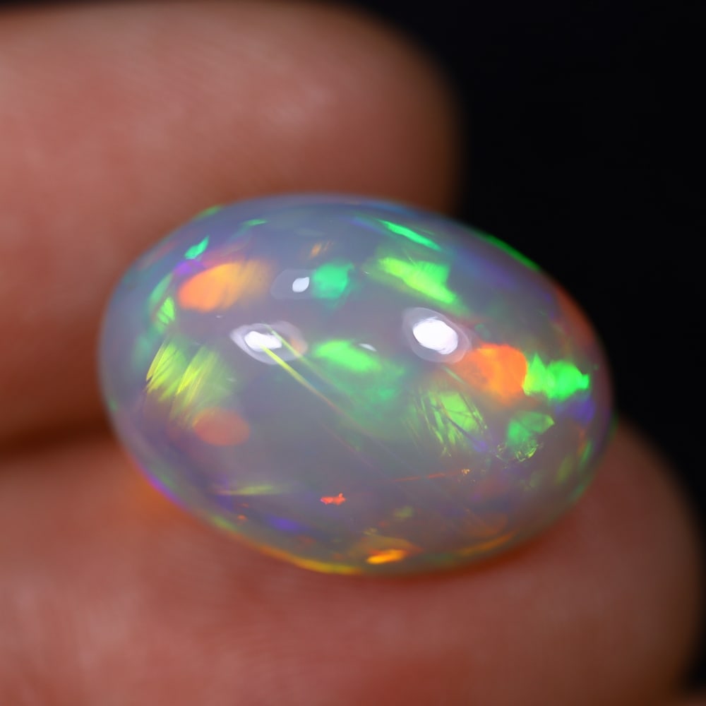 *10.95Ct Welo Opal Polished - Ethiopian Opal , 455C: Ksmith Heritage Auctioneers Subject: Natural Ethiopian Welo Opal Origin: Ethiopia Carat Weight: 10.95Ct Dimension: 17.1x12.3x10.4 mm Treatment: Natural Untreated Type: Cab