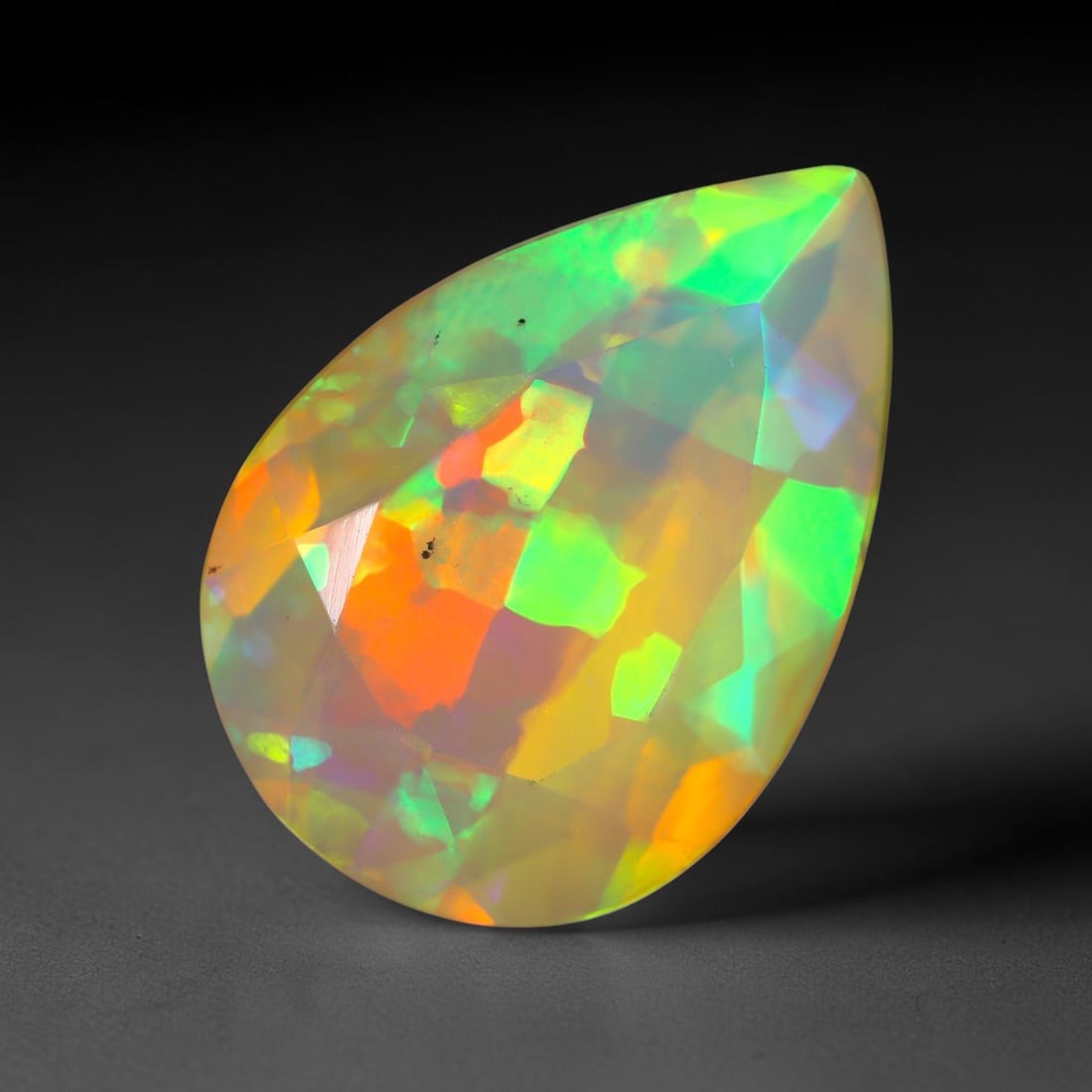 3.49Ct Natural Ethiopian Opal, Faceted Cut - 14.2x9.9x6.7 mm , 686C: Ksmith Heritage Auctioneers Subject: Natural Ethiopian Welo Opal Origin: Ethiopia Treatment: Unheated