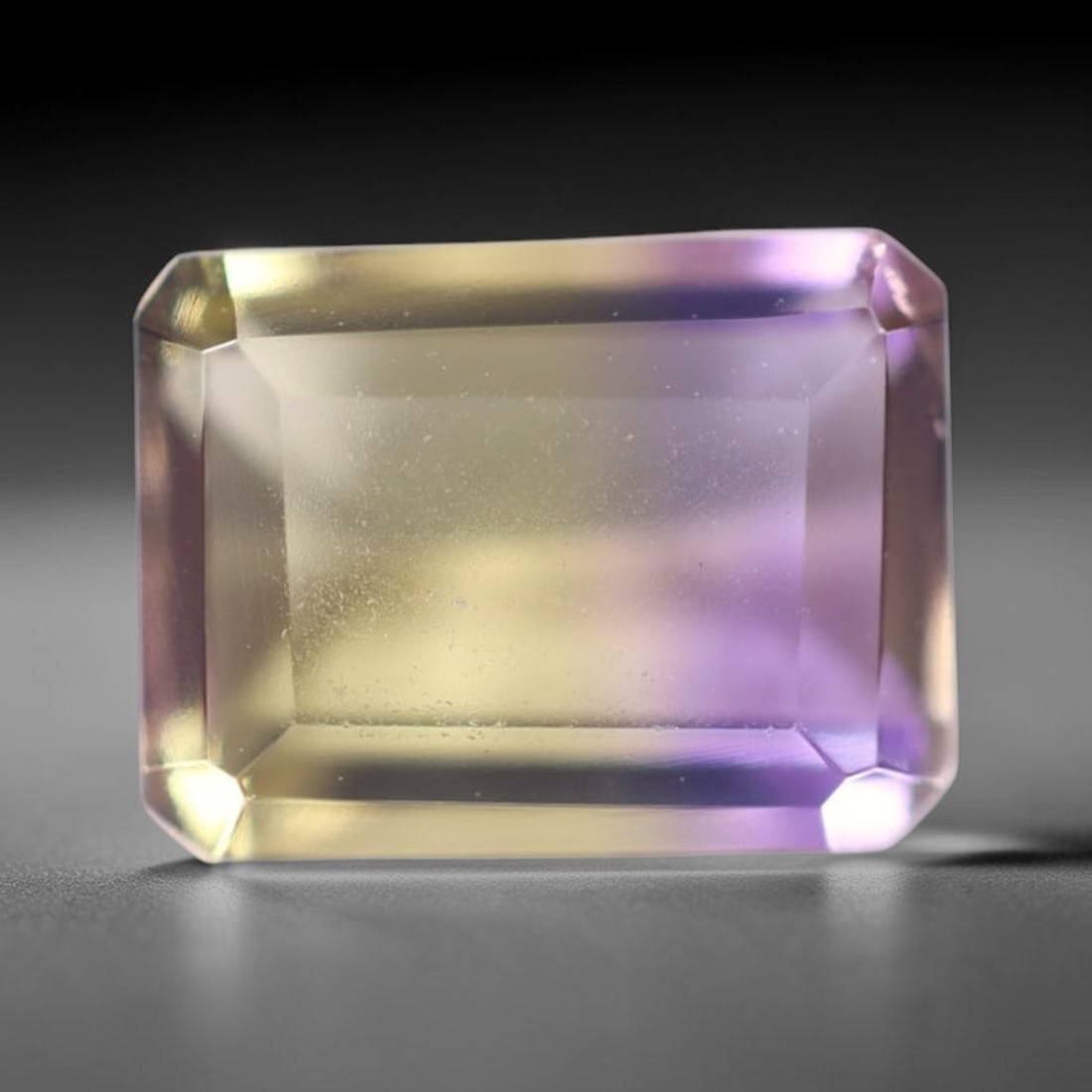 1.61Ct Ametrine - Polished Faceted - Rectangle Faceted , 350E: Ksmith Heritage Auctioneers Subject: Natural Ametrine Origin: Bolivia Carat Weight: 1.61Ct Dimension: 8x6x4.1 mm Treatment: Unheated Shape: Rectangle Type: Facet