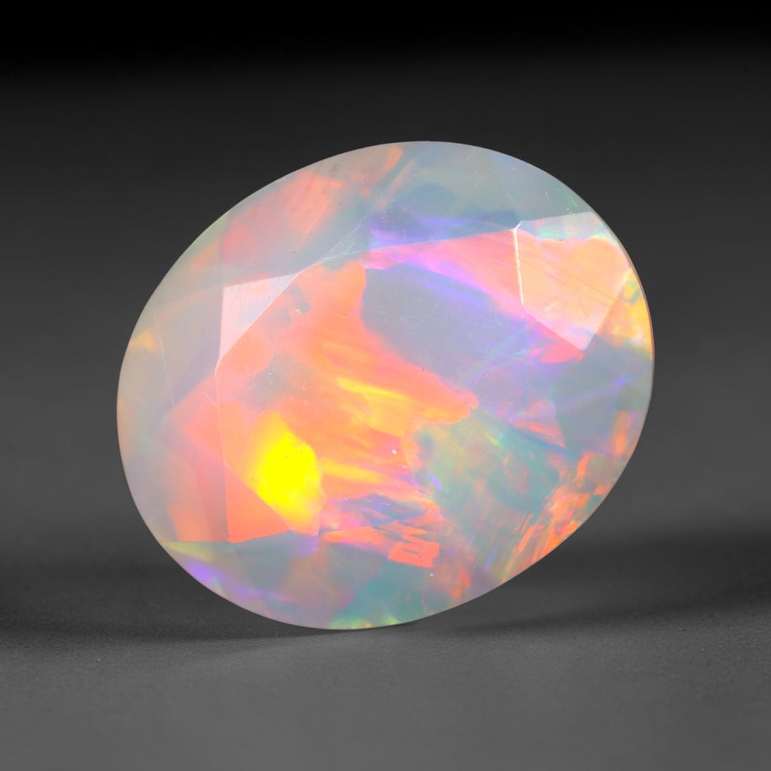 2.98Ct Natural Ethiopian Opal, Faceted Cut - 12.0x10.0x5.8 mm , 664C: Ksmith Heritage Auctioneers Subject: Natural Ethiopian Welo Opal Origin: Ethiopia Treatment: Unheated