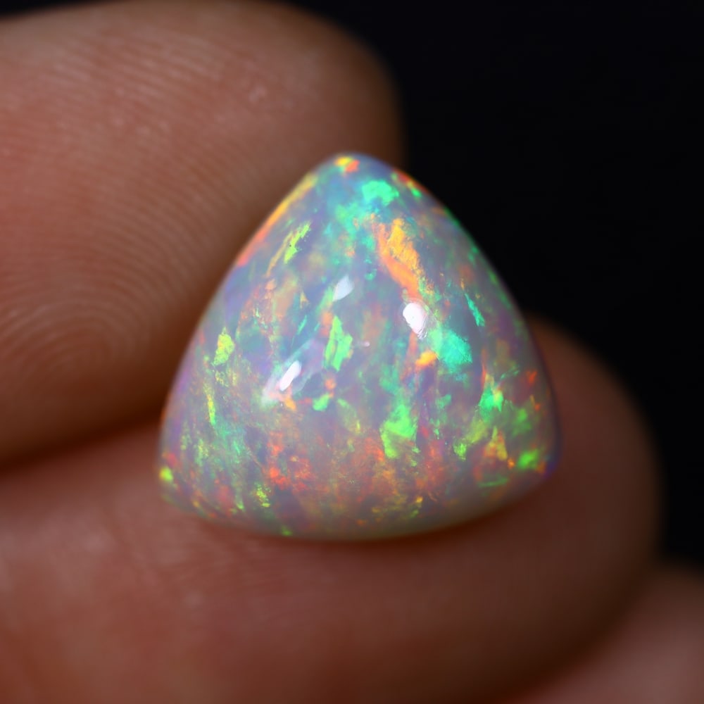 *6.13Ct Welo Opal Polished - Ethiopian Opal , 395C: Ksmith Heritage Auctioneers Subject: Natural Ethiopian Welo Opal Origin: Ethiopia Carat Weight: 6.13Ct Dimension: 13.4x13.1x7.8 mm Treatment: Natural Untreated Type: Caboc