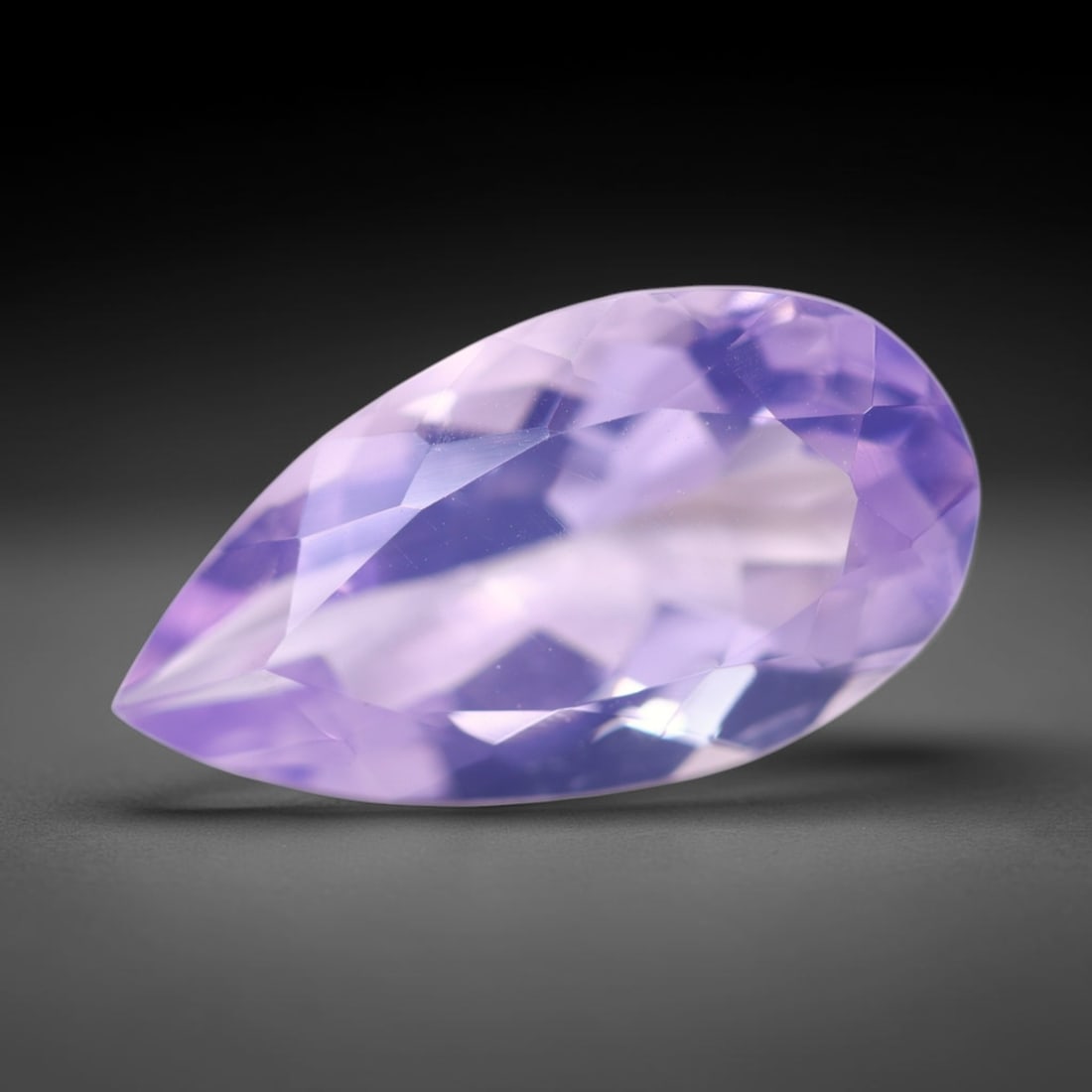 9.37Ct Lavender Amethyst - Polished Faceted , 942E: Ksmith Heritage Auctioneers Subject: Natural Lavender Amethyst Origin: Brazil Carat Weight: 9.37Ct Dimension: 20.4x11.1x8 mm Treatment: Untreated Type: Faceted, Polished